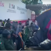 VIDEO: African migrants hurl garbage cans, tents at Mexican police, demand passage to US